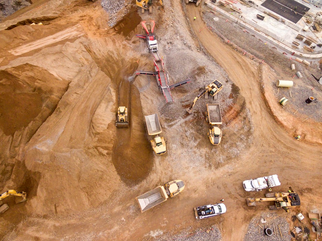 Construction truck and heavy equipment outdoors